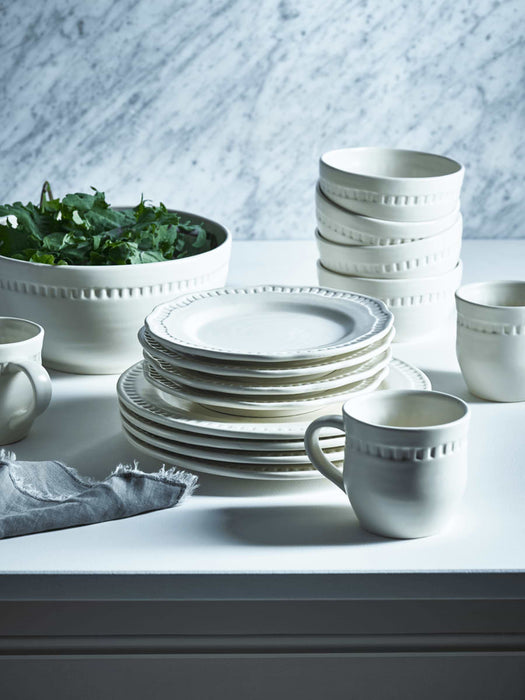 Four Embossed White Side Plates