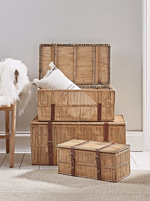 Three Flat Rattan Trunks