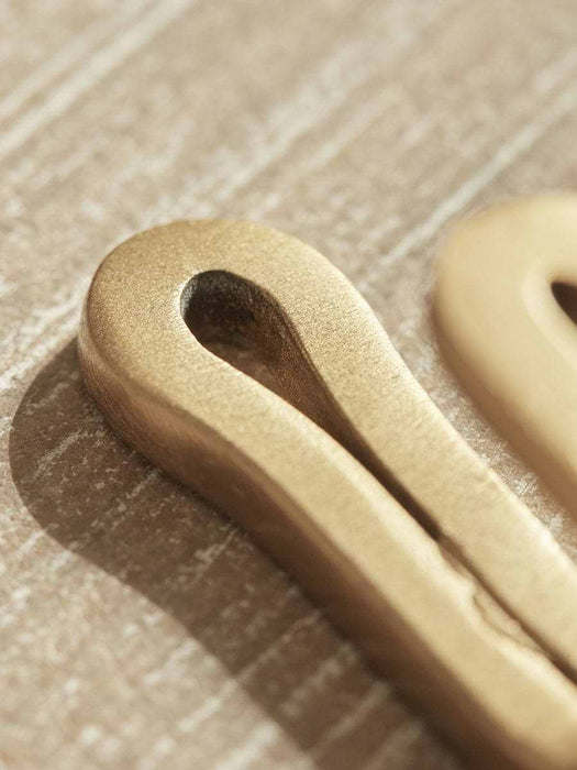 Four Small Brass Hooks