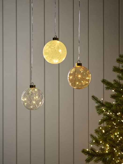 Three Light Up Glass Spheres