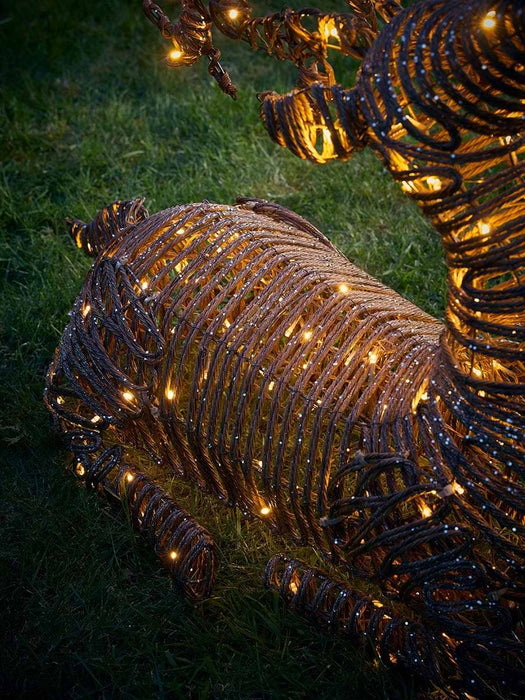 Soft Gold Faux Wicker Sit Down Lit Reindeer