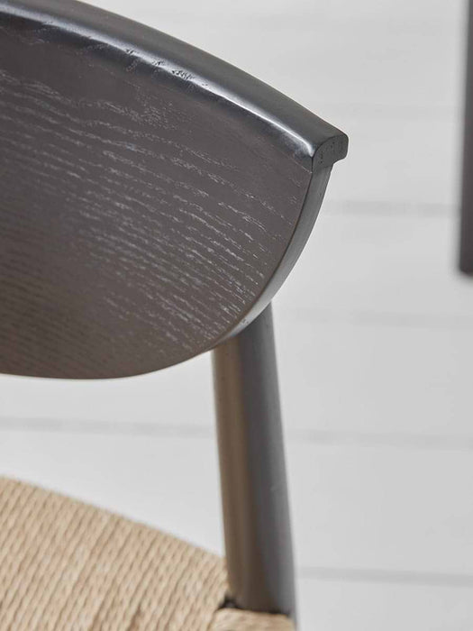 Two Black & Natural Woven Dining Chairs