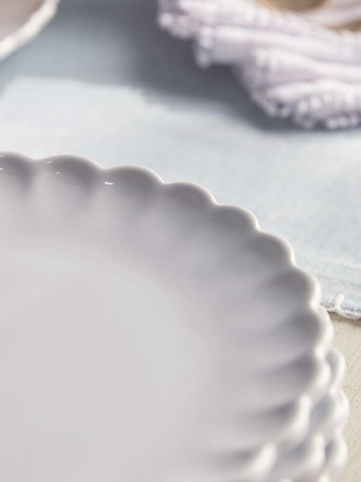 Four Scalloped Edge Side Plates