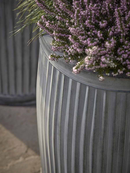 Two zinc Barrel Planters