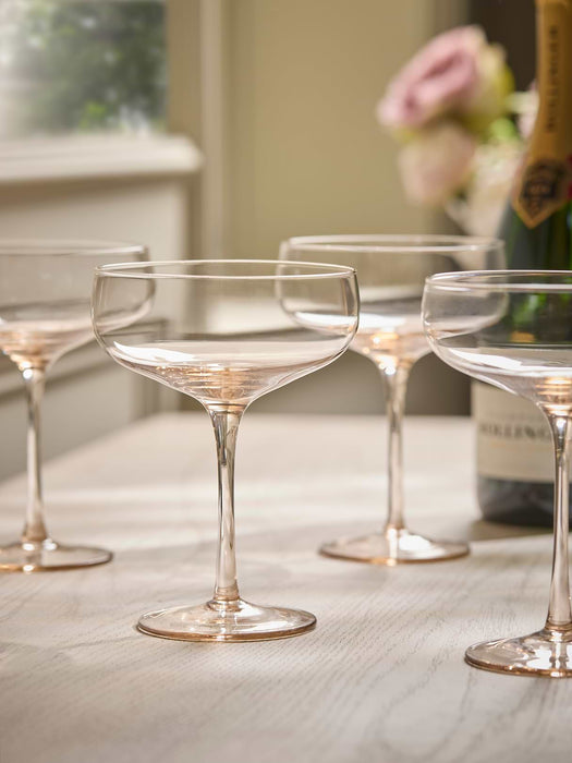Four Golden Champagne Coupes