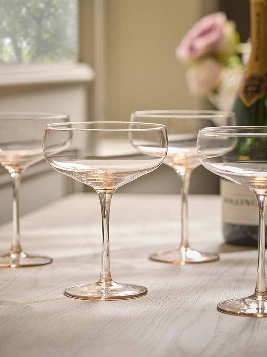 Four Golden Champagne Coupes