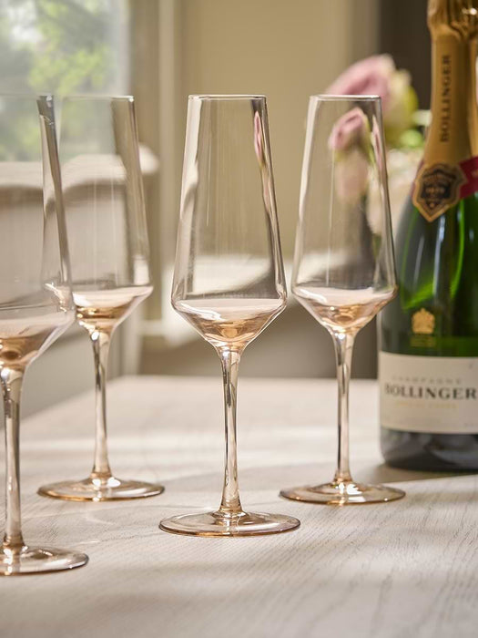 Four Golden Champagne Coupes