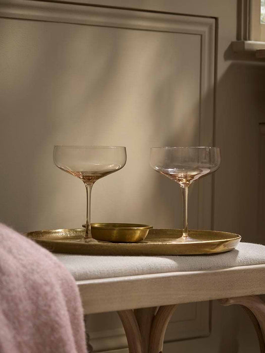 Four Golden Champagne Coupes